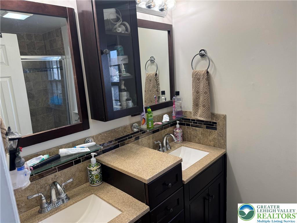 717 Liberty Street Emmaus, PA 18049 - Photo 20 of 35 a bathroom with a sink and a mirror