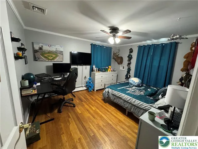 a bedroom with furniture and a window