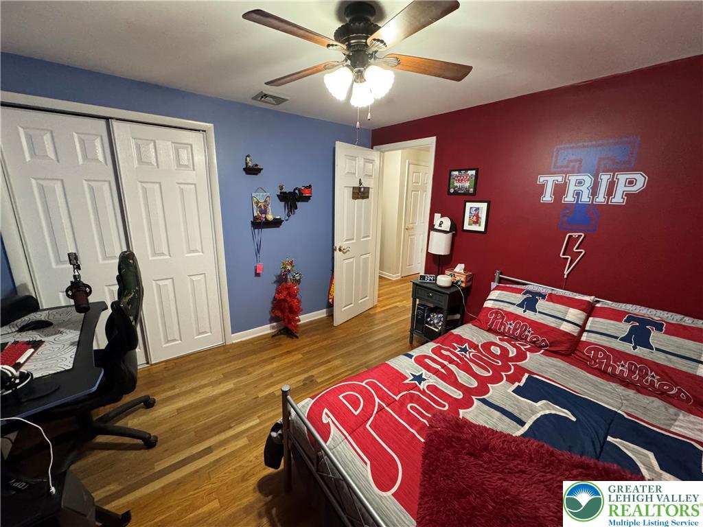 717 Liberty Street Emmaus, PA 18049 - Photo 26 of 35 a bedroom with a bed and wooden floor