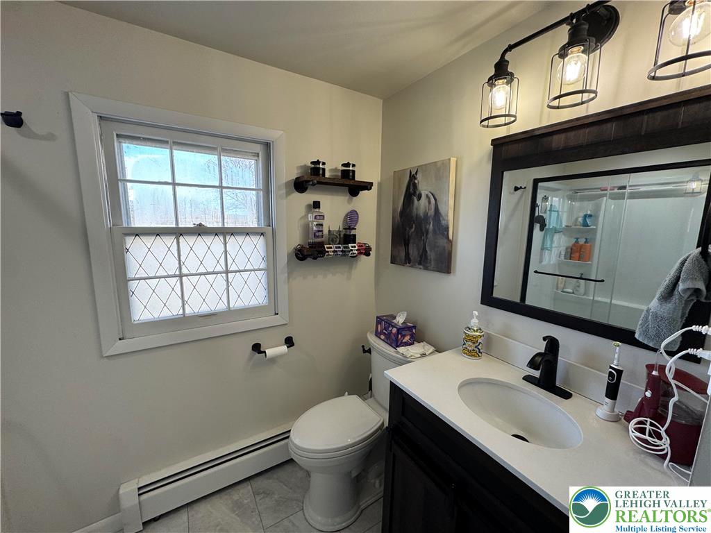717 Liberty Street Emmaus, PA 18049 - Photo 30 of 35 a bathroom with a sink vanity mirror and toilet