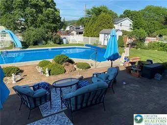 a view of an outdoor sitting area with furniture