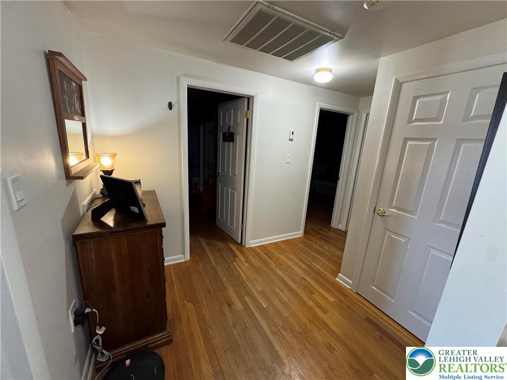 717 Liberty Street Emmaus, PA 18049 - Photo 6 of 35 a view of a hallway with wooden floor and stairs