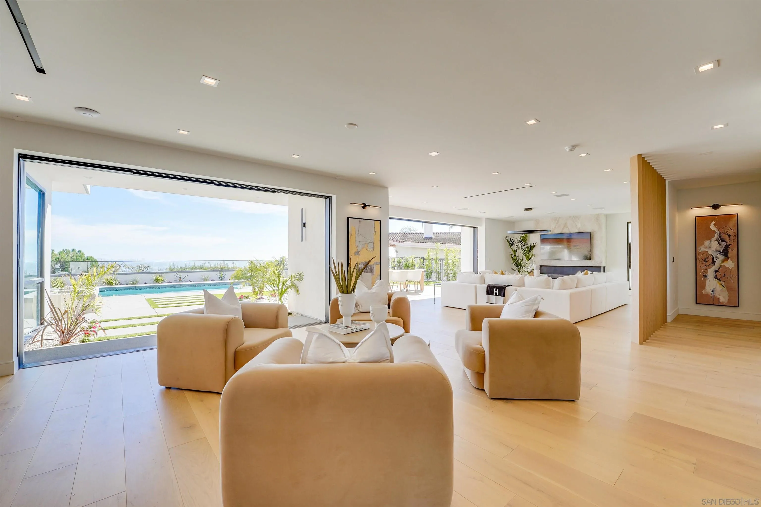 1205 La Jolla Rancho Road La Jolla, CA 92037 - Photo 11 of 75 a living room with furniture and a large window