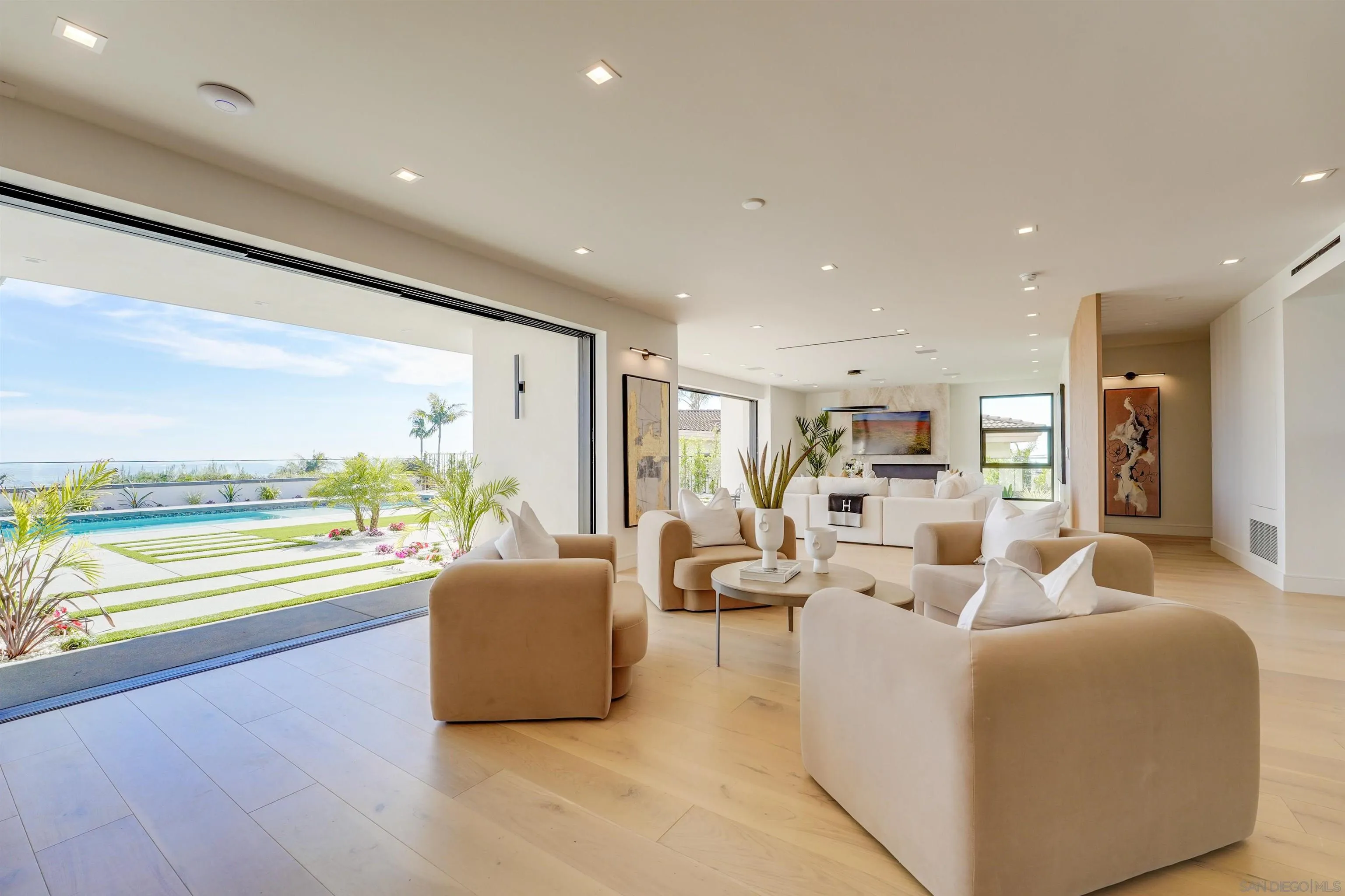 1205 La Jolla Rancho Road La Jolla, CA 92037 - Photo 12 of 75 a living room with furniture and a large window