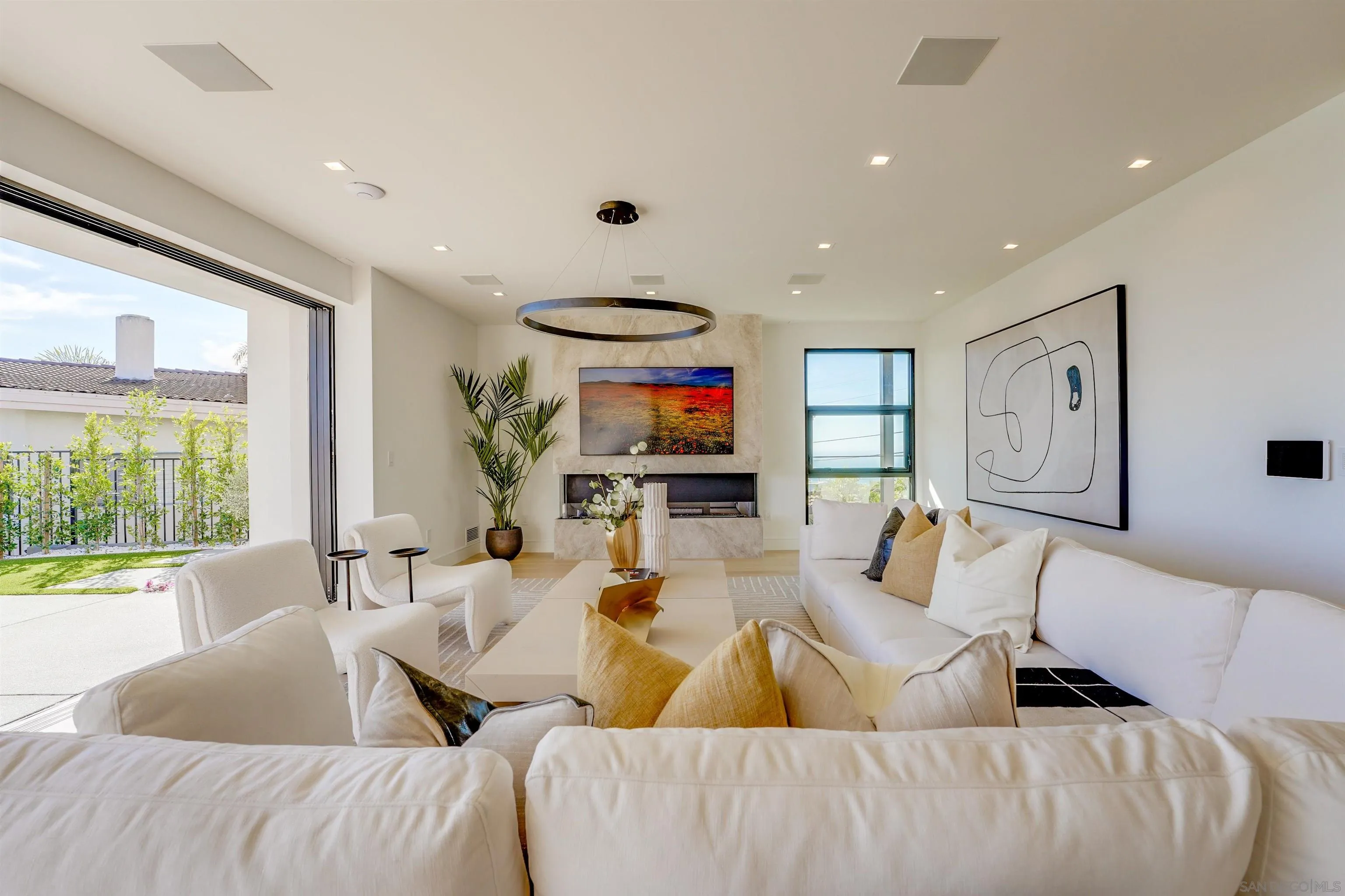 1205 La Jolla Rancho Road La Jolla, CA 92037 - Photo 15 of 75 a living room with furniture and a flat screen tv