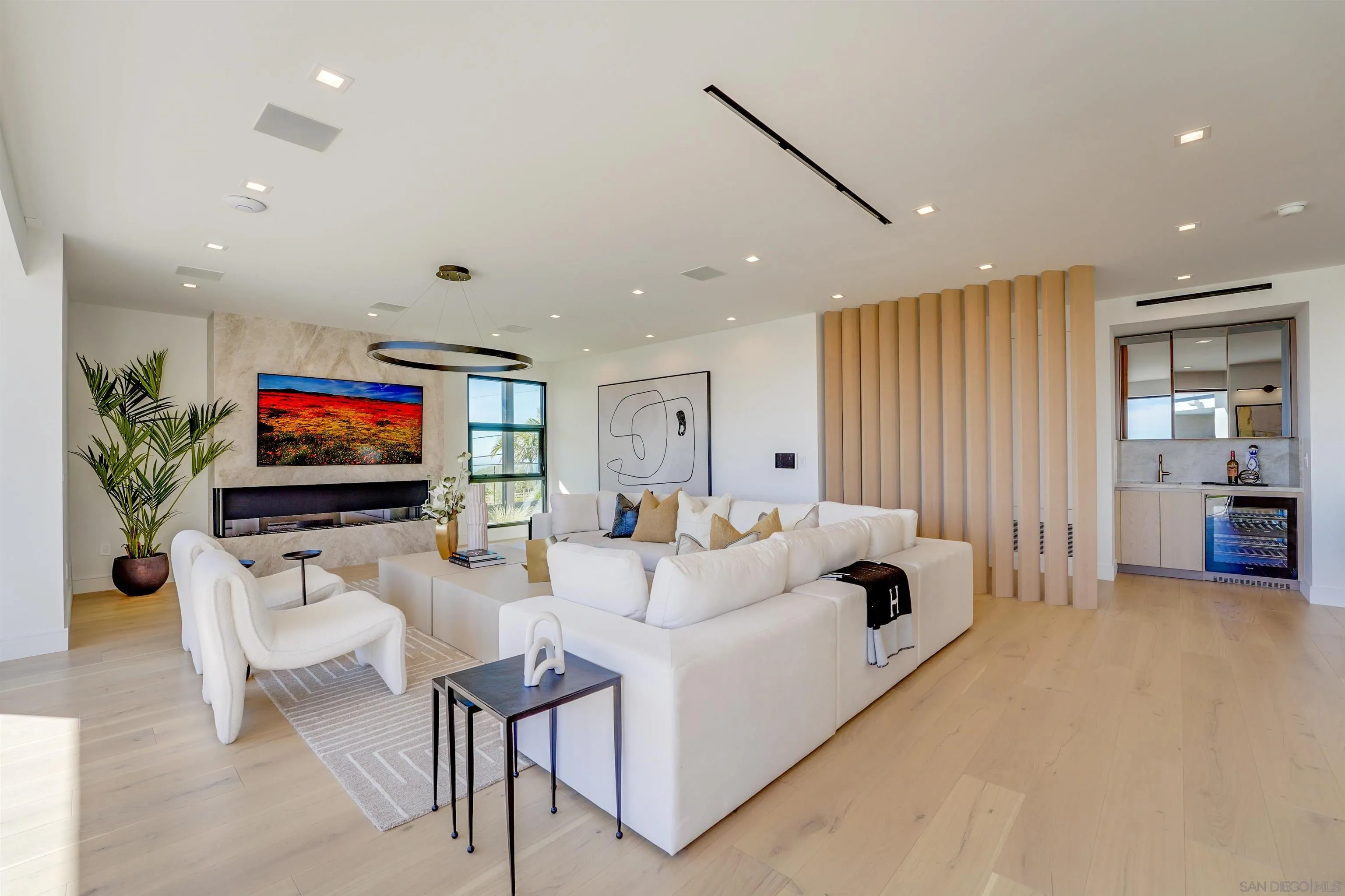1205 La Jolla Rancho Road La Jolla, CA 92037 - Photo 16 of 75 a living room with furniture and a flat screen tv