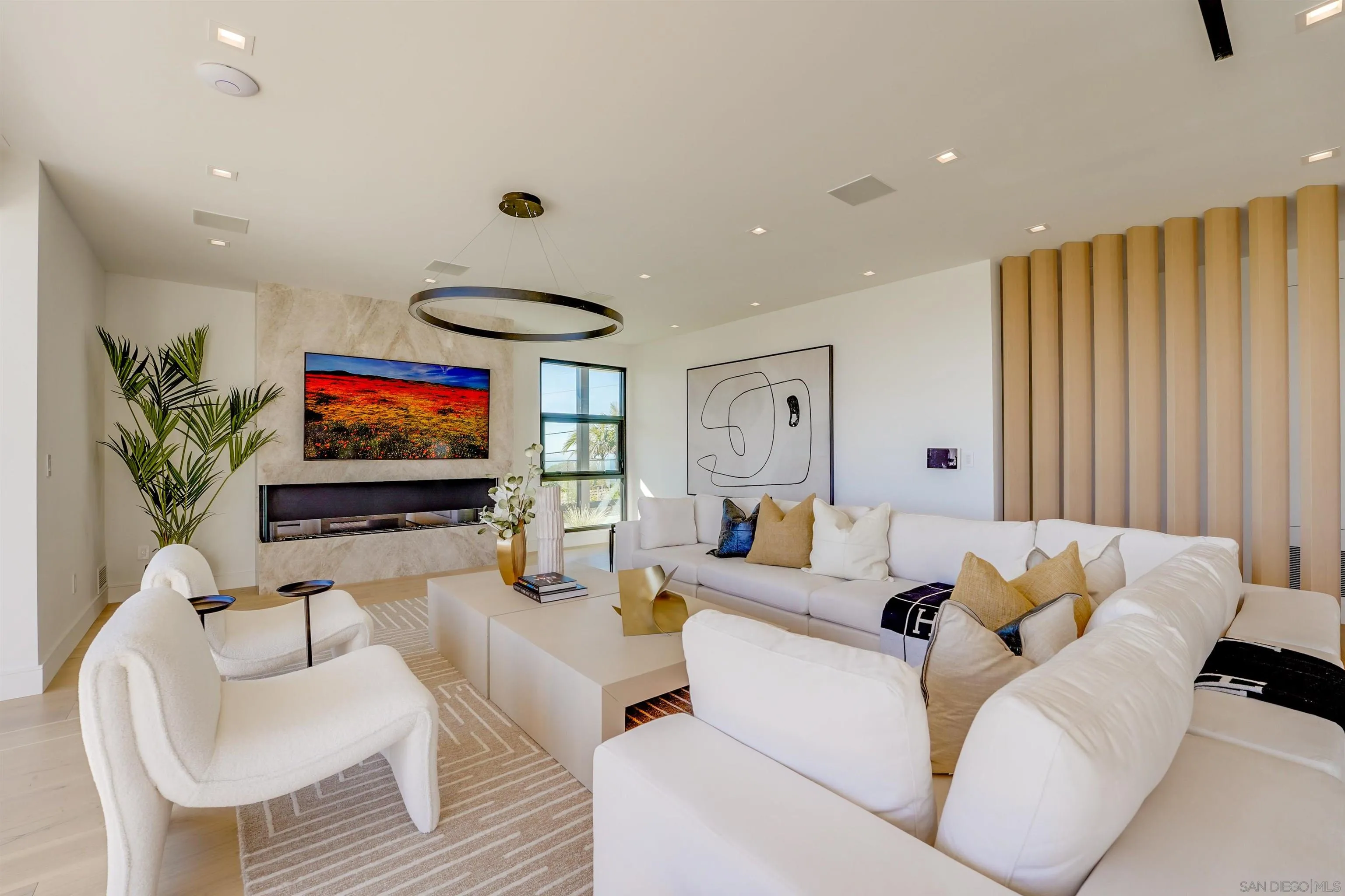 1205 La Jolla Rancho Road La Jolla, CA 92037 - Photo 17 of 75 a living room with furniture and a flat screen tv