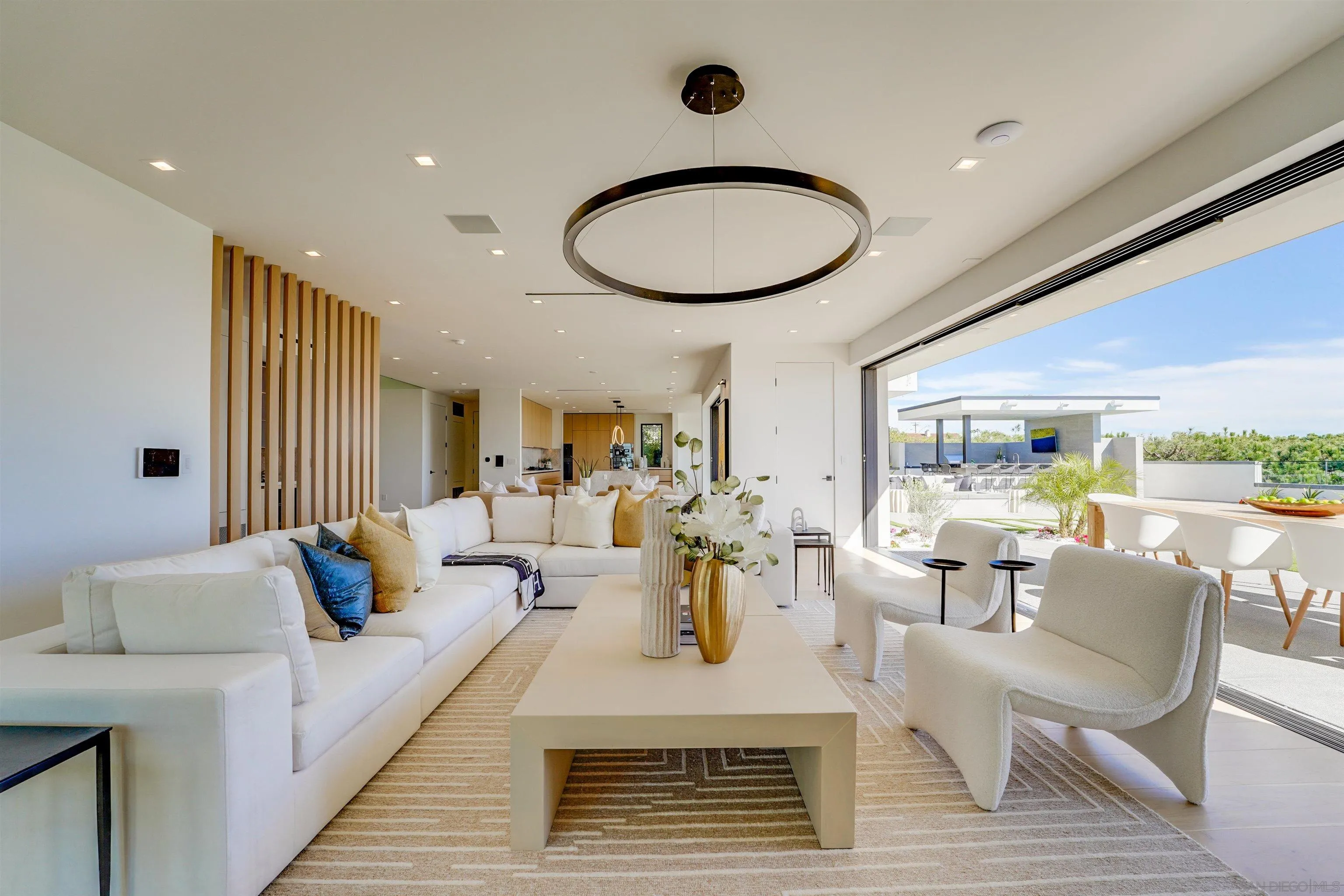 1205 La Jolla Rancho Road La Jolla, CA 92037 - Photo 19 of 75 a living room with furniture and wooden floor