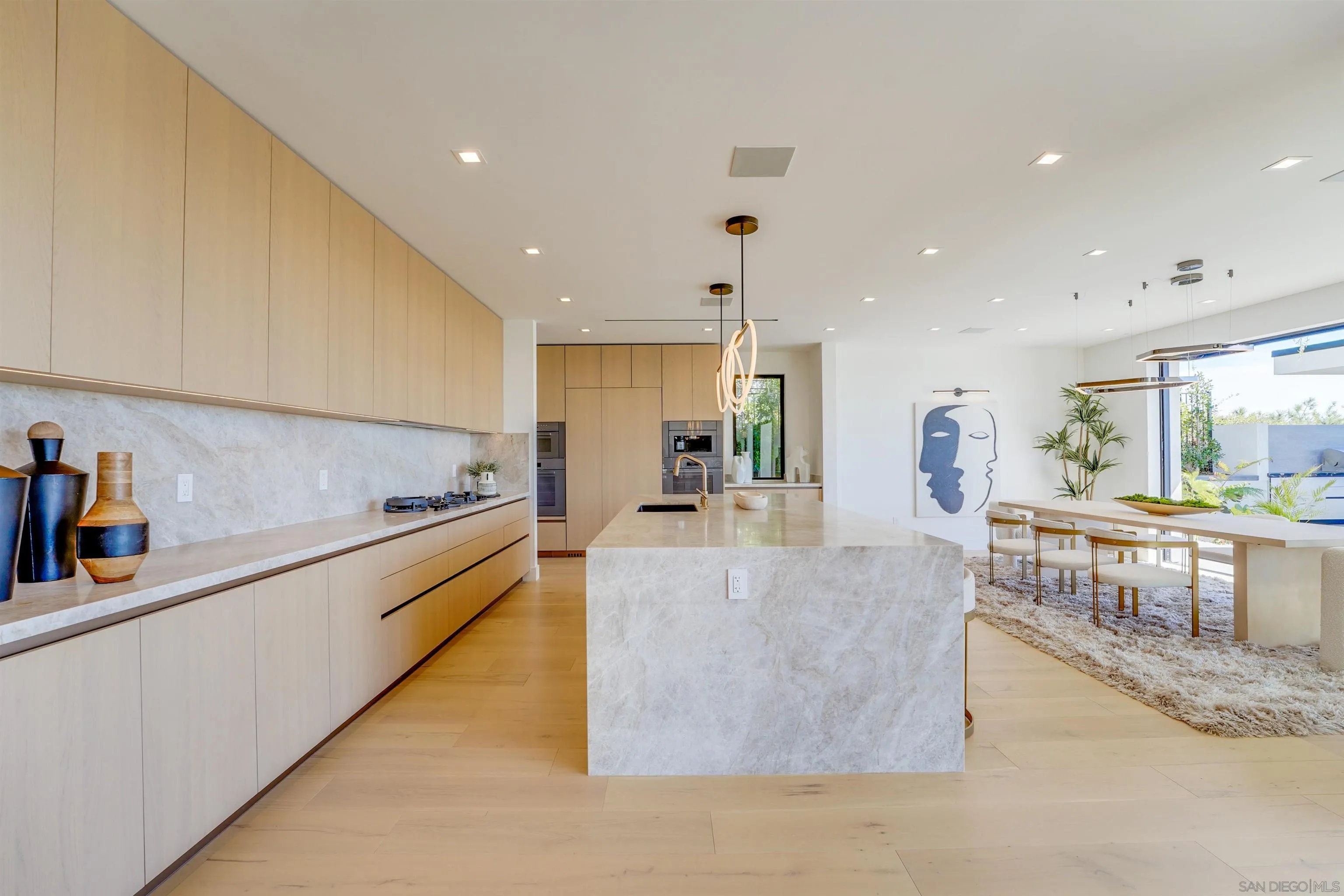 1205 La Jolla Rancho Road La Jolla, CA 92037 - Photo 22 of 75 a large kitchen with stainless steel appliances lots of counter space and a sink