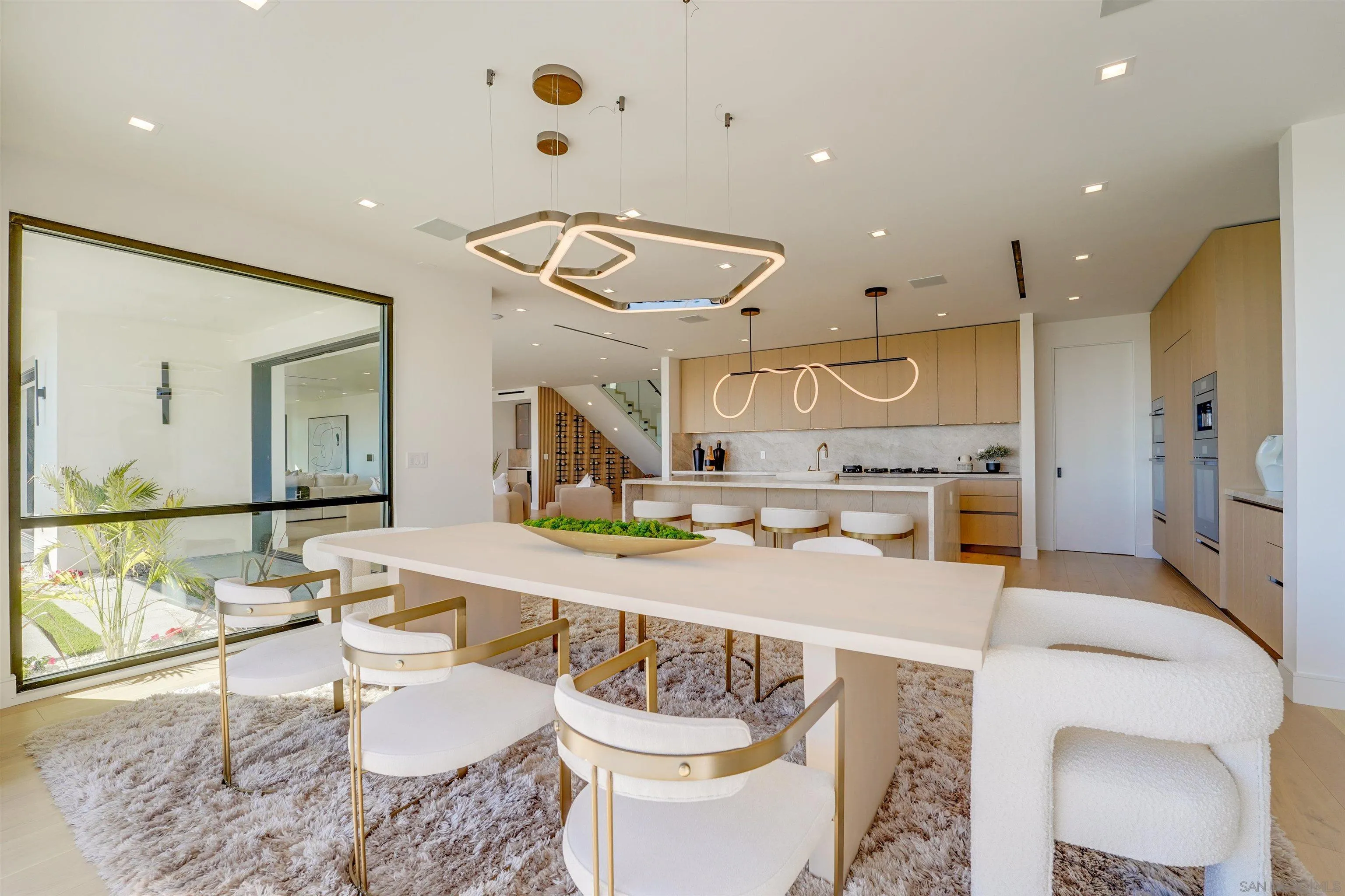 1205 La Jolla Rancho Road La Jolla, CA 92037 - Photo 27 of 75 a large kitchen with a table and chairs