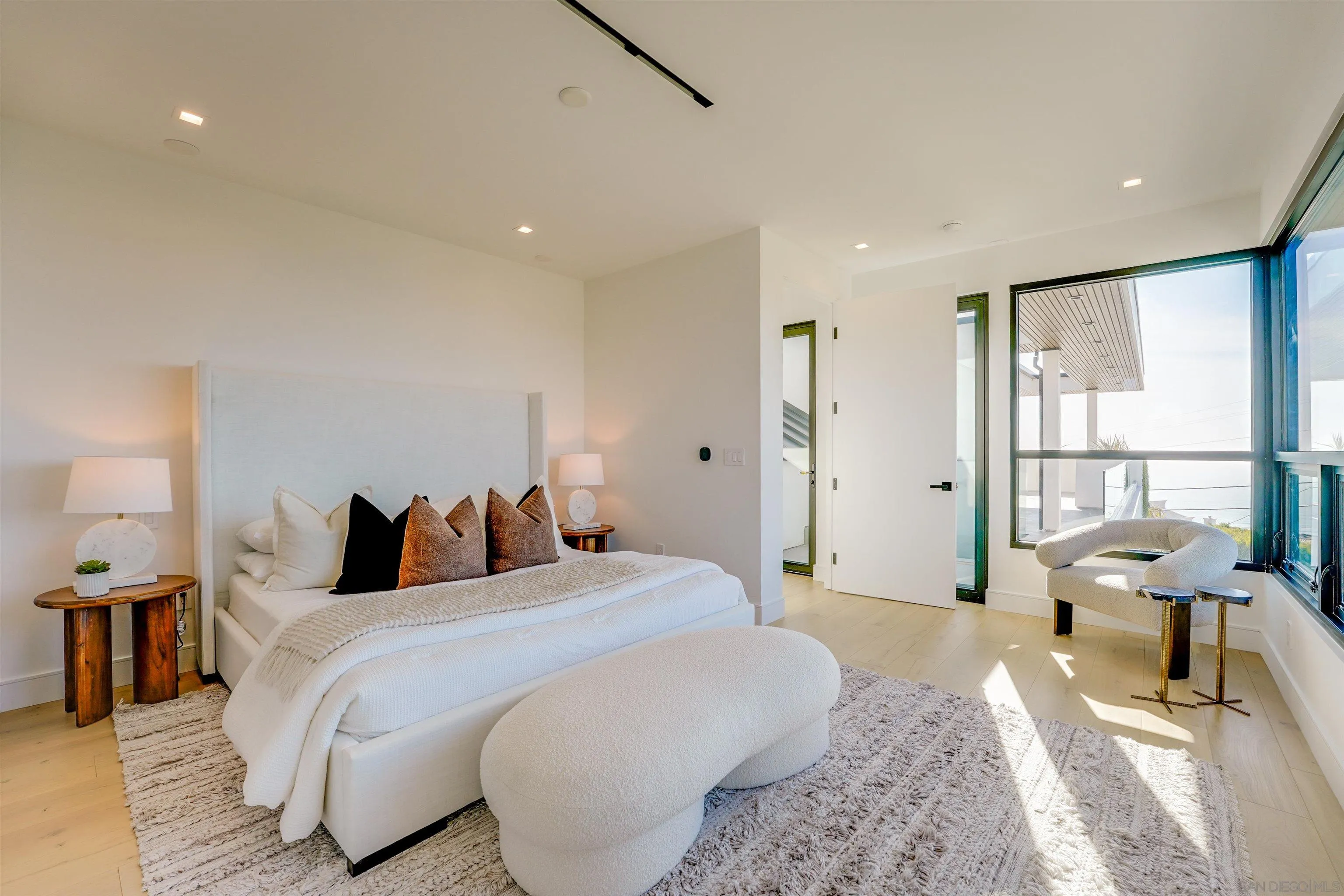 1205 La Jolla Rancho Road La Jolla, CA 92037 - Photo 47 of 75 a bedroom with a bed and wooden floor