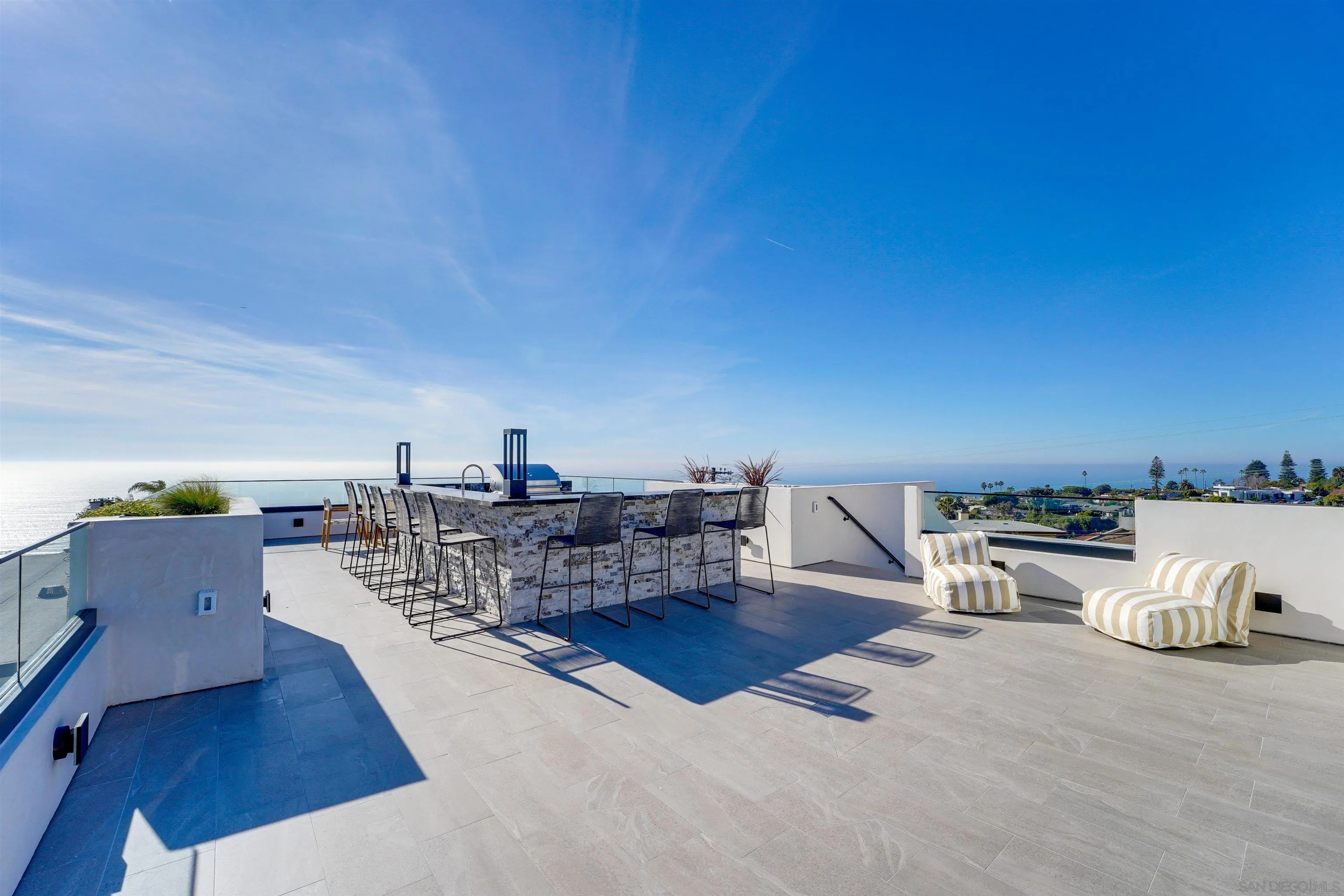 1205 La Jolla Rancho Road La Jolla, CA 92037 - Photo 48 of 75 a living room with furniture and wooden floor