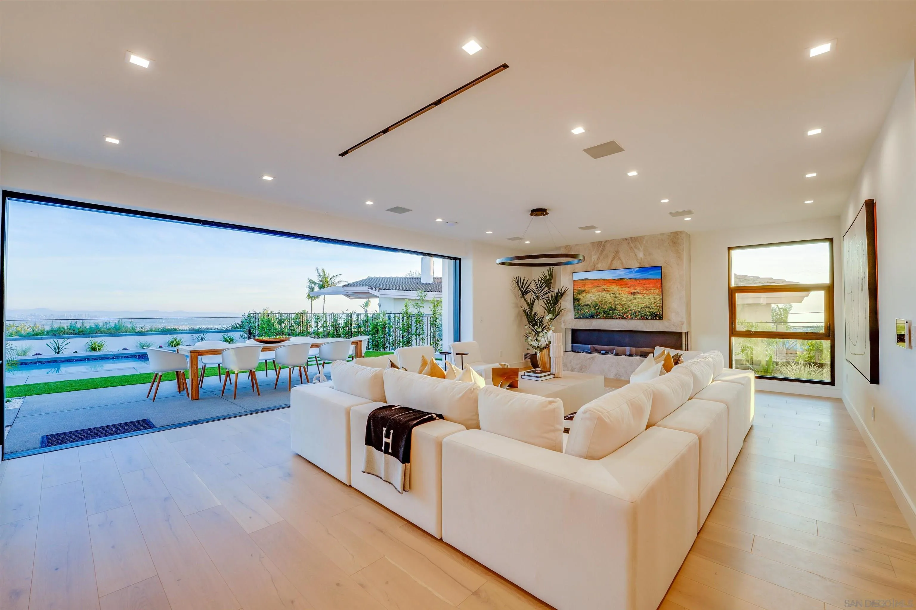 1205 La Jolla Rancho Road La Jolla, CA 92037 - Photo 60 of 75 a living room with furniture and a flat screen tv