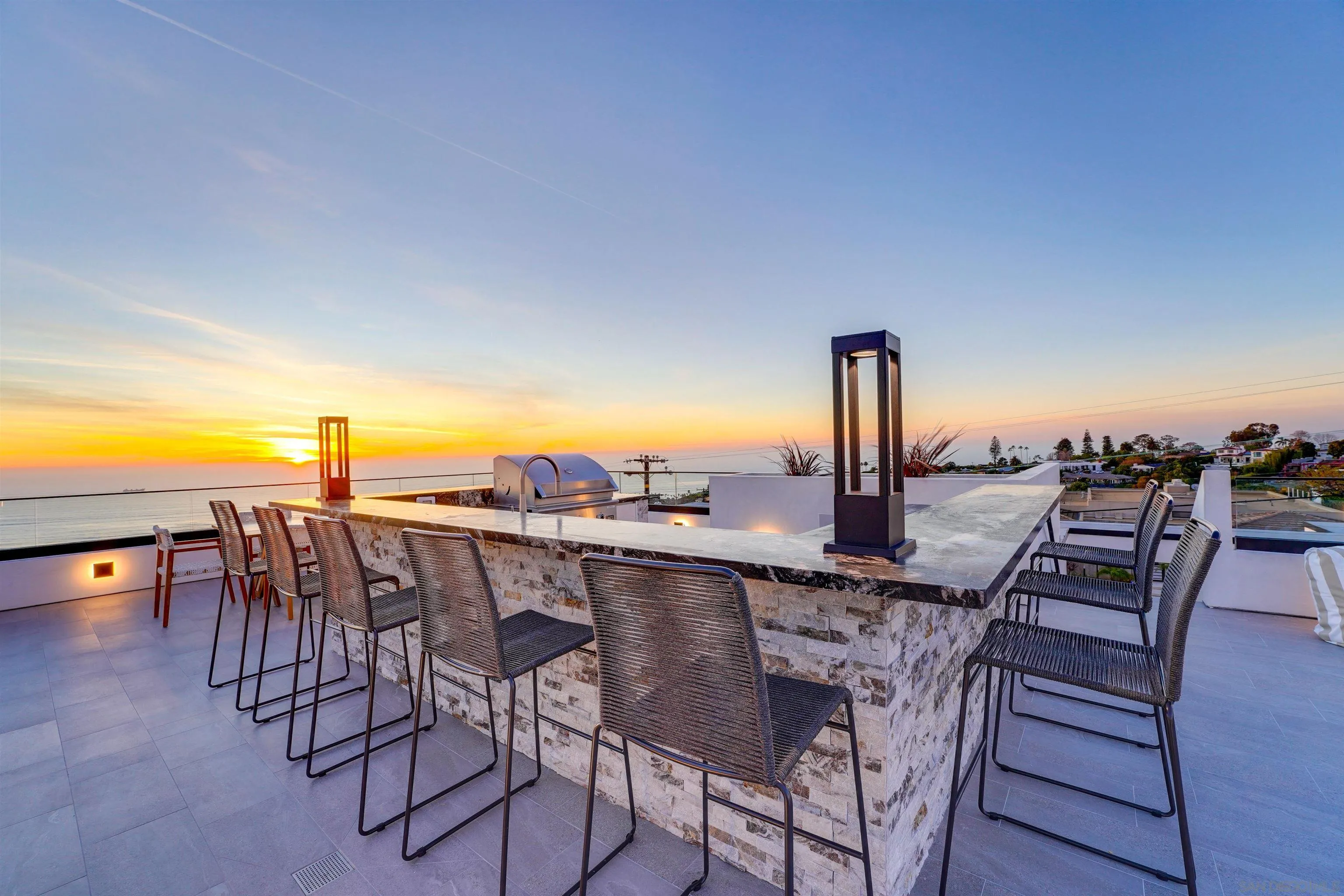 1205 La Jolla Rancho Road La Jolla, CA 92037 - Photo 63 of 75 a view of a patio with a table and chairs