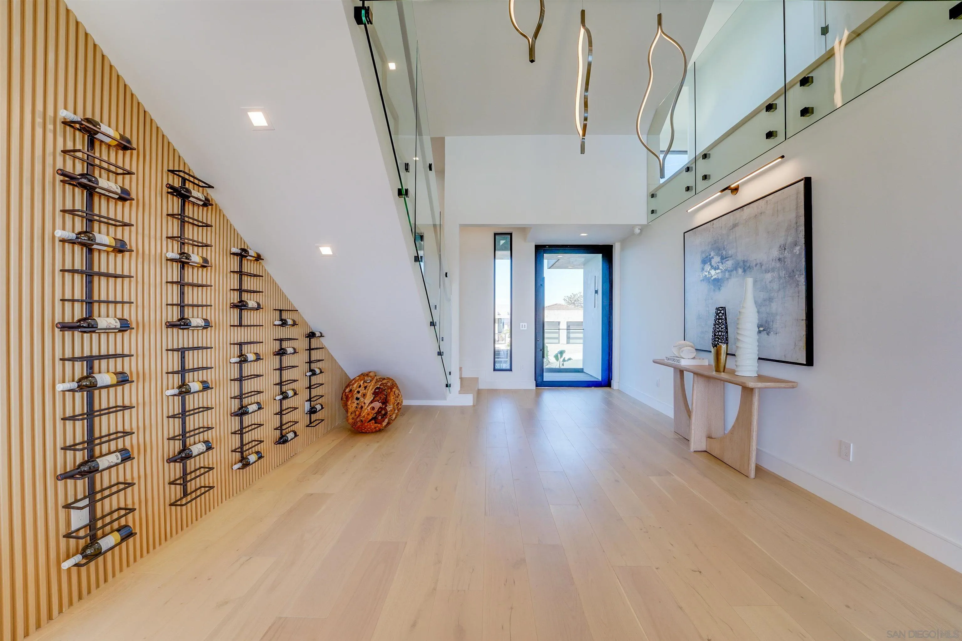 1205 La Jolla Rancho Road La Jolla, CA 92037 - Photo 10 of 75 a view of livingroom with furniture and wooden floor