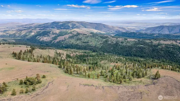 a view of a lake with mountains in the background