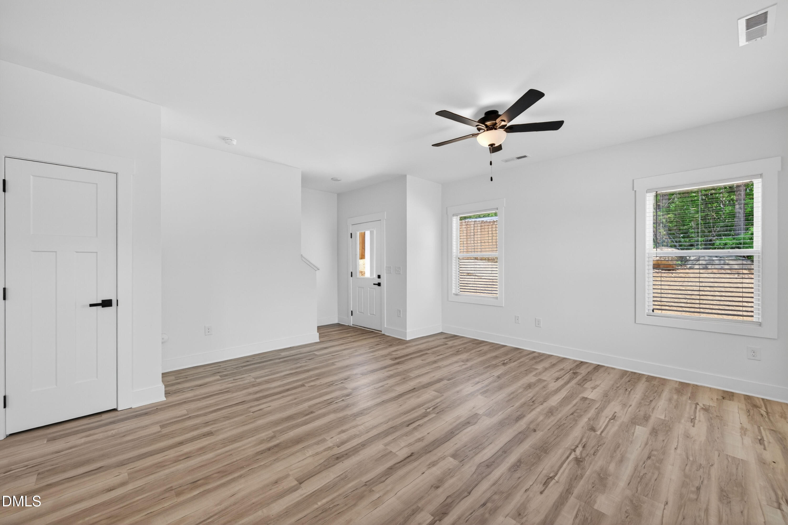 1182 Hurdle Mills Road Roxboro, NC 27573 - Photo 15 of 45 wooden floor in an empty room with a window