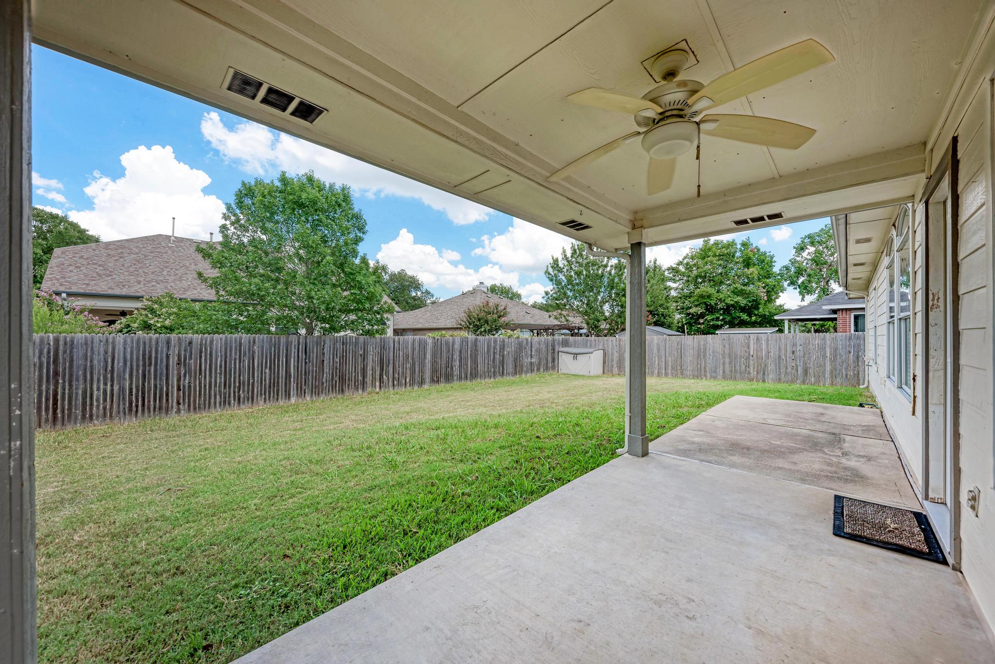 4408 Tello Path Austin, TX 78749 - Photo 31 of 38 Fenced backyard with a patio area and a ceiling fan