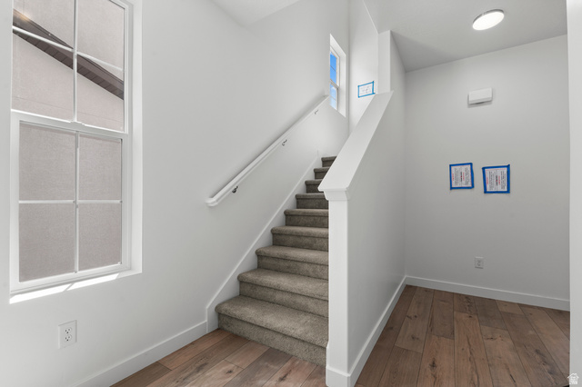 7797 West Alta Springs Way Magna, UT 84044 - Photo 6 of 21 Stairs featuring wood-type flooring and baseboards