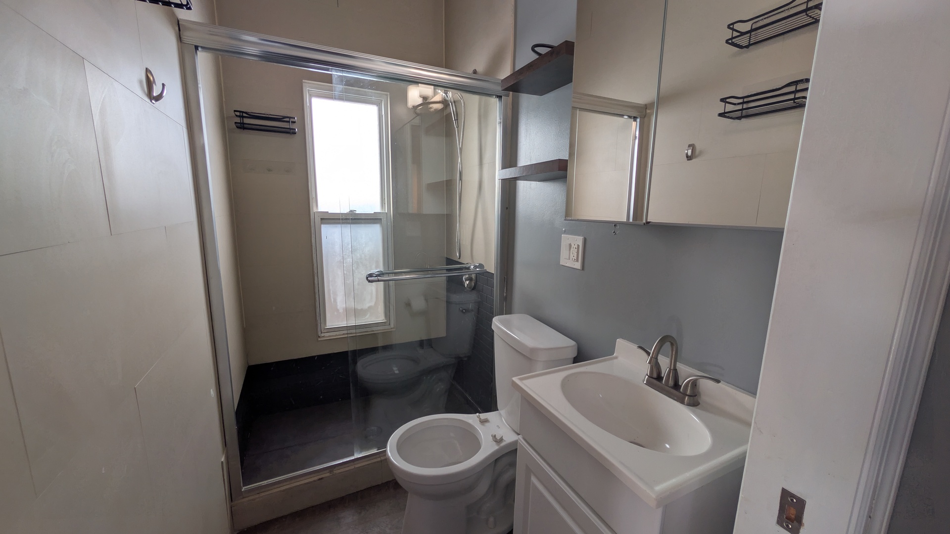 1629 West Beach Avenue, Unit 2R Chicago, IL 60622 - Photo 6 of 6 a bathroom with a sink toilet and shower