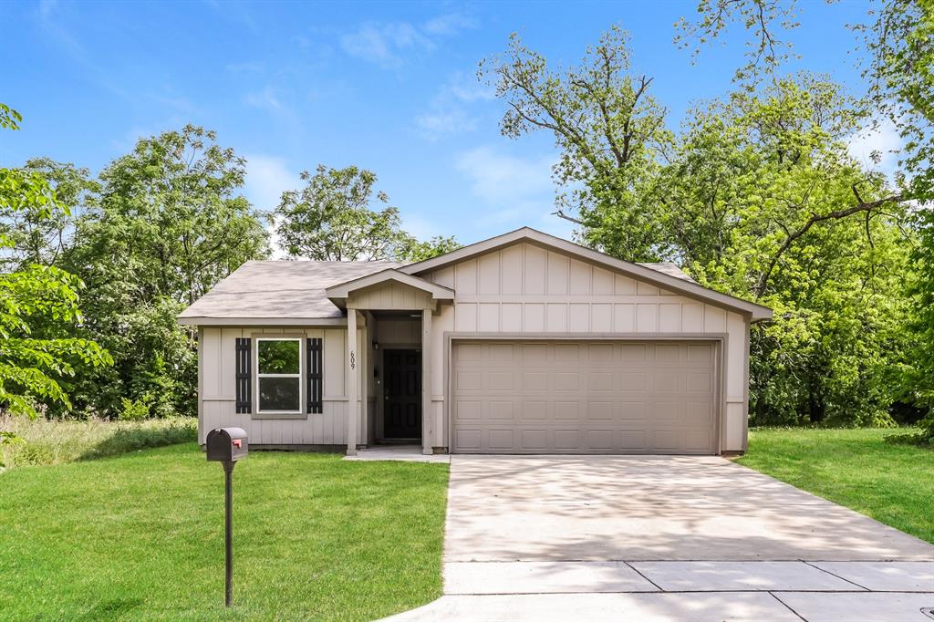 609 Sherman Street Waco, TX 76704 - Photo 1 of 21 a house with trees in the background
