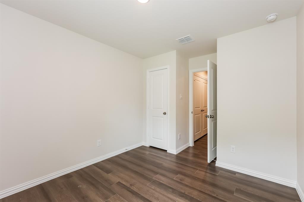 609 Sherman Street Waco, TX 76704 - Photo 11 of 21 a view of an empty room with wooden floor