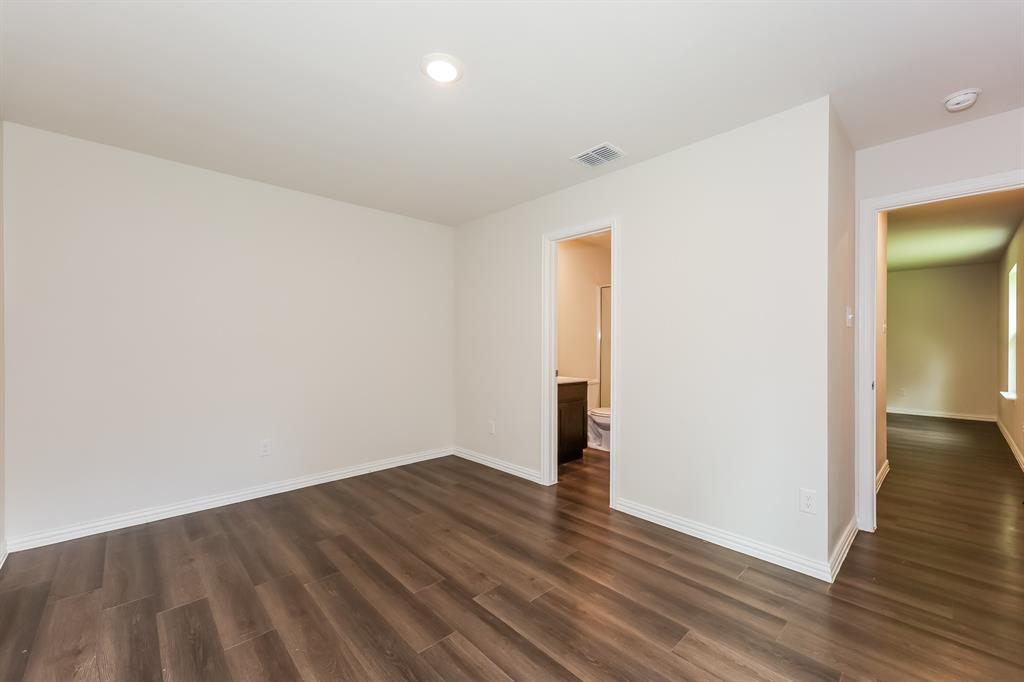 609 Sherman Street Waco, TX 76704 - Photo 14 of 21 an empty room with wooden floor