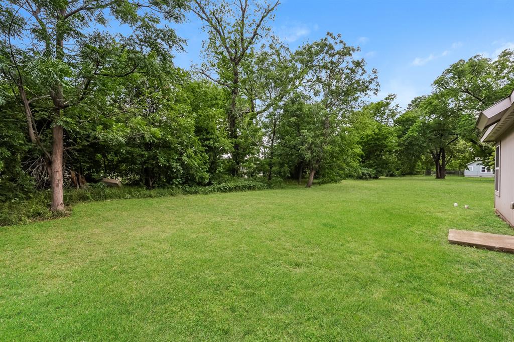 609 Sherman Street Waco, TX 76704 - Photo 20 of 21 a view of a field with trees in the background