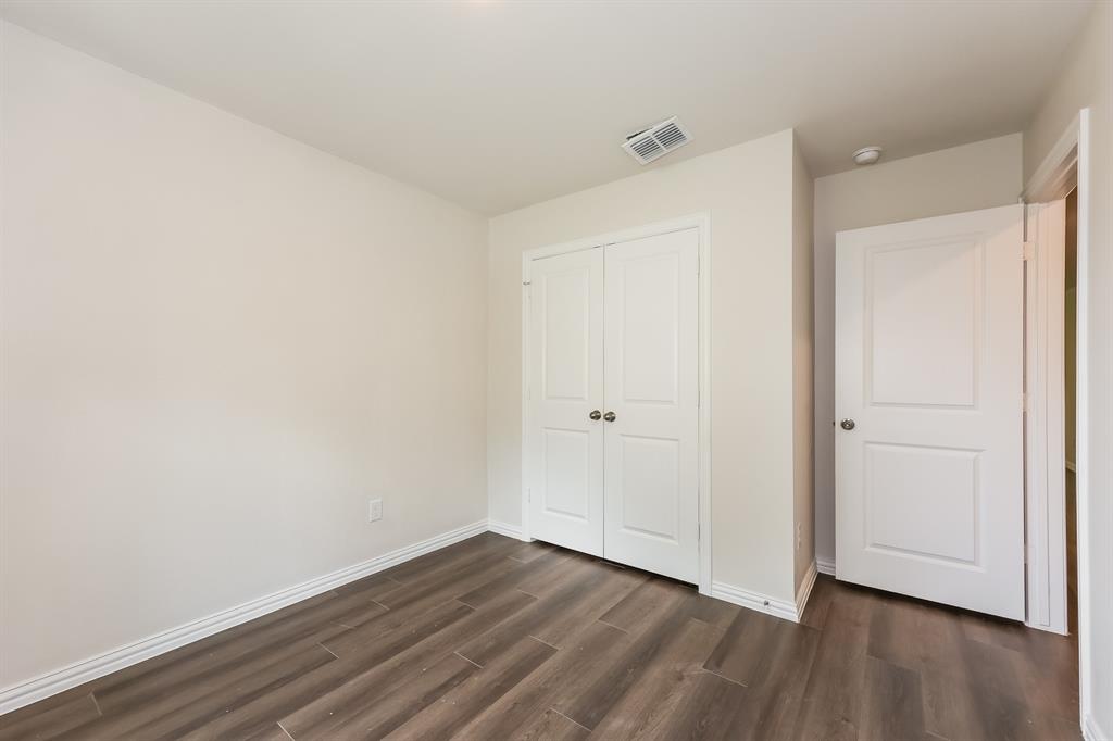 609 Sherman Street Waco, TX 76704 - Photo 9 of 21 a view of an empty room with wooden floor