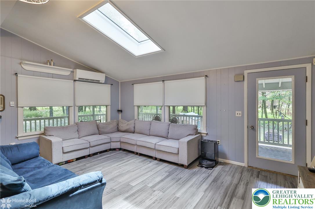60 Sassafras Road Lehighton, PA 18235 - Photo 22 of 36 A skylight brightens this living area, offering a view of the outdoors from comfortable seating.