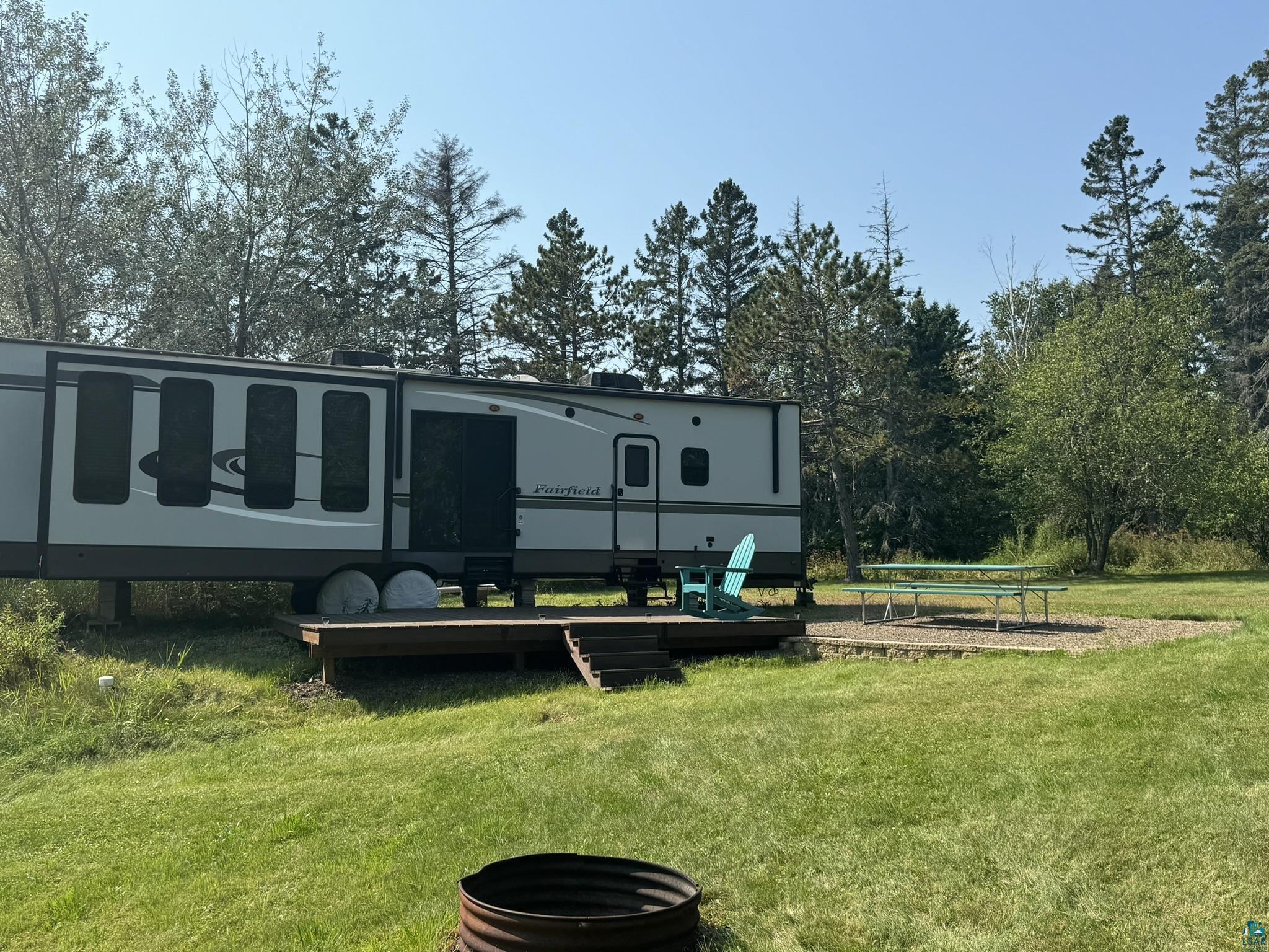 Rear view of property featuring a lawn