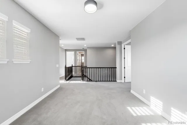 a view of a hallway with a window