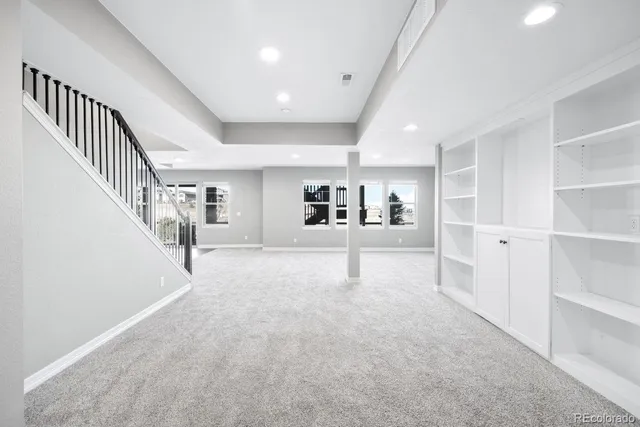 a view of empty room with a fireplace