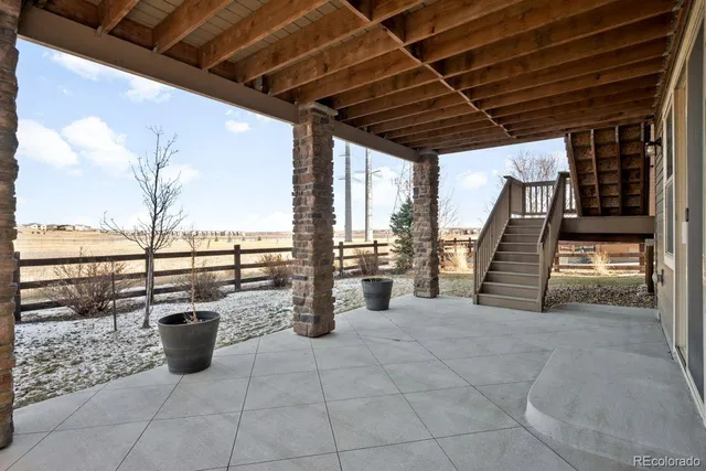 a view of a balcony with wooden floor