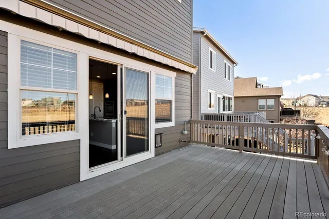 a view of balcony with wooden floor