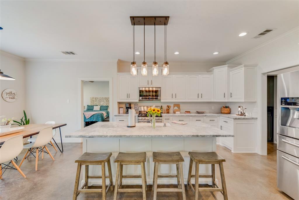 4320 Highway 198 Canton, TX 75103 - Photo 13 of 26 a view of a dining room with furniture a chandelier and wooden floor