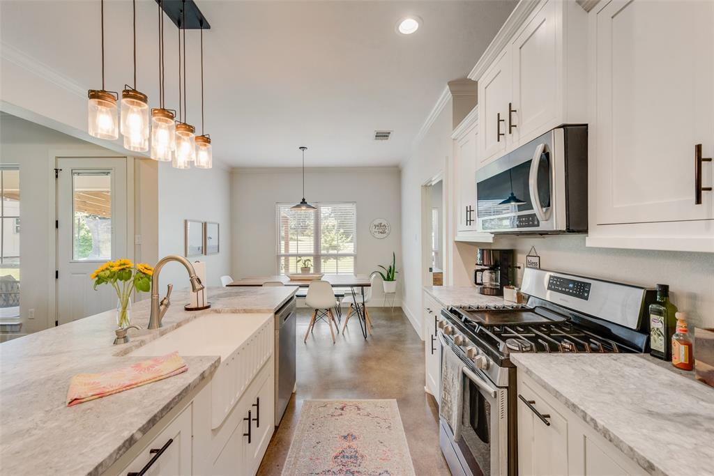 4320 Highway 198 Canton, TX 75103 - Photo 14 of 26 a kitchen with a stove a sink and a refrigerator