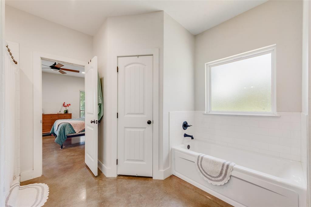 4320 Highway 198 Canton, TX 75103 - Photo 19 of 26 a bathroom with a granite countertop sink mirror and toilet