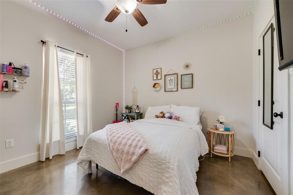 4320 Highway 198 Canton, TX 75103 - Photo 25 of 26 a bedroom with a bed and a chandelier