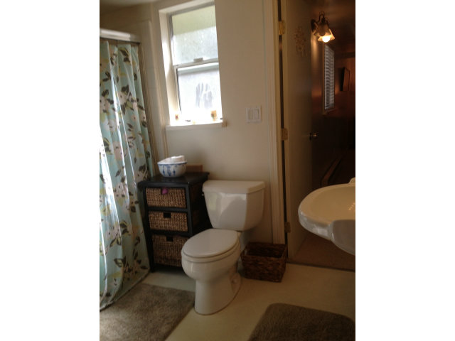 0 Lincoln Street Carmel, CA 93921 - Photo 14 of 20 a bathroom with a toilet and a shower curtain