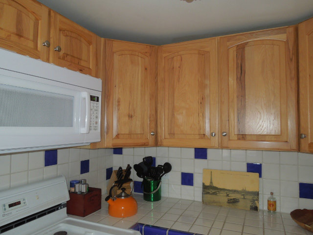 0 Lincoln Street Carmel, CA 93921 - Photo 5 of 20 a kitchen with stainless steel appliances wooden cabinets and a counter top space