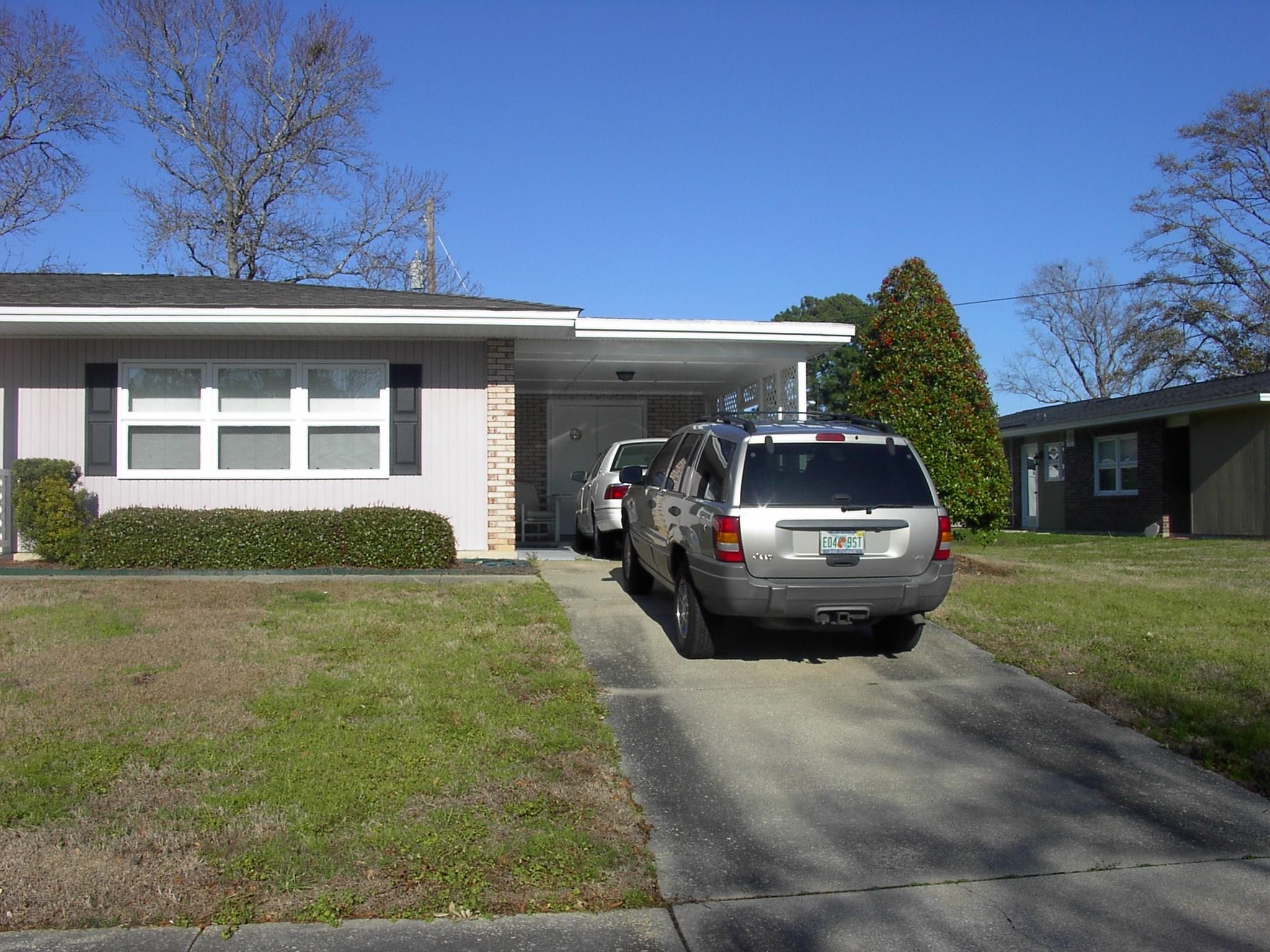 3752 Tea Rose Street, Unit 3752 Myrtle Beach, SC 29577 - Photo 2 of 8 Ranch-style house with a front yard, driveway, and a carport