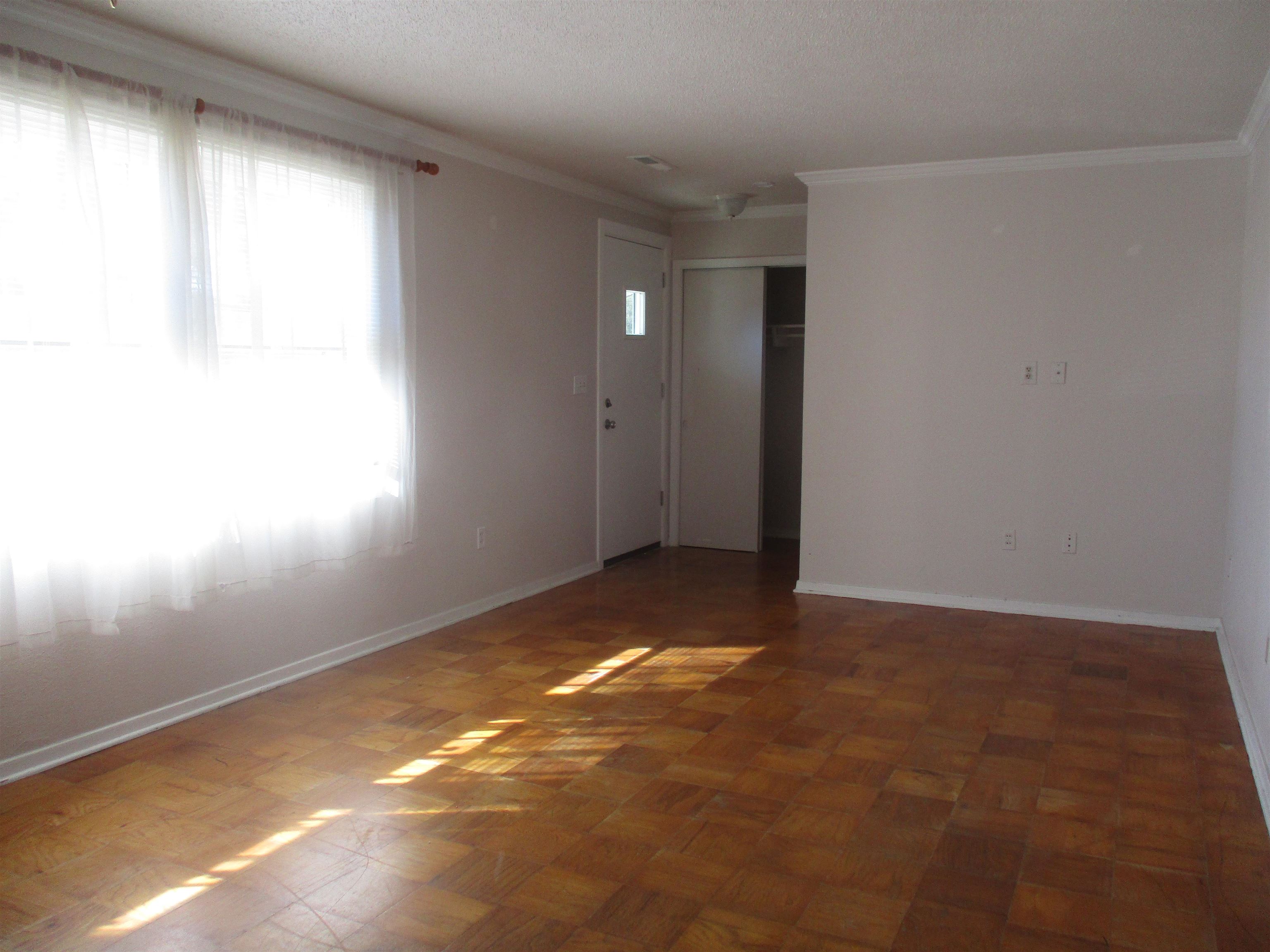 3752 Tea Rose Street, Unit 3752 Myrtle Beach, SC 29577 - Photo 5 of 8 Spare room with crown molding and a textured ceiling