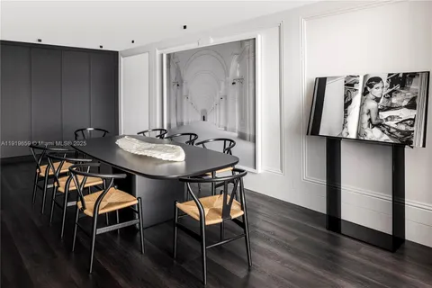 a dining room with furniture and wooden floor