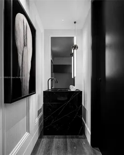 a living room with a mirror and a fireplace