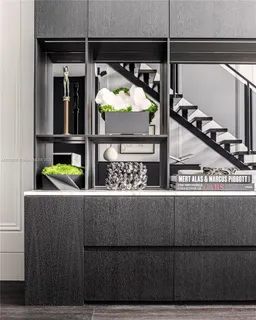 a living room with chairs and a table