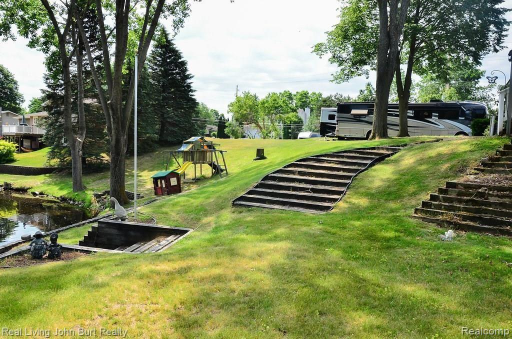 425 Sanders Road Oxford, MI 48371 - Photo 25 of 27 LARGE LOT WITH BUILT IN STAIRS DOWN TO THE WATER