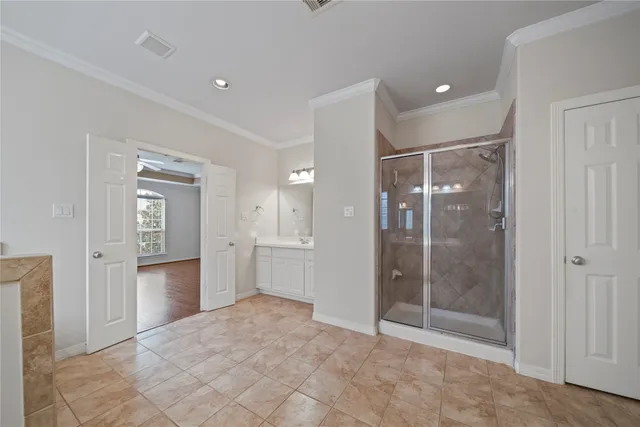 a bathroom with a shower and a sink