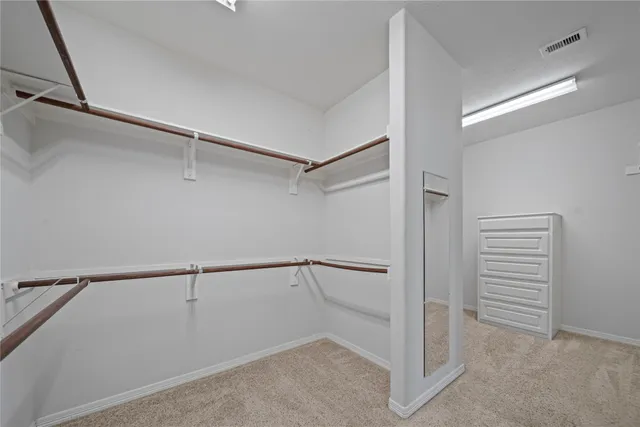a view of an empty walk in closet