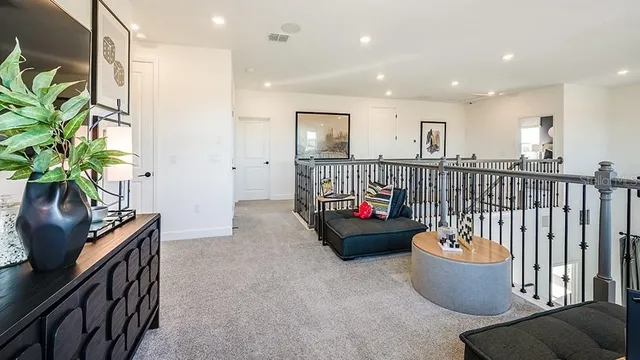 a view of a hallway with seating area